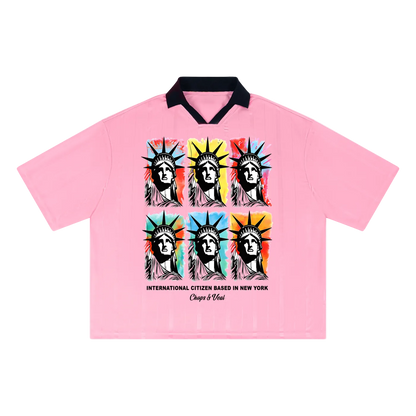 Pink shirt with colorful Liberty head design on a white background